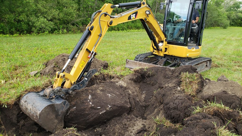 Professional landscaping crew working with specialized equipment