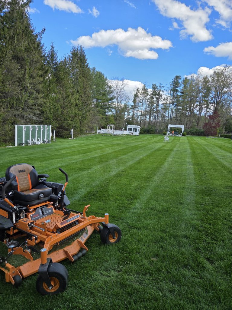 Professional lawn mowing equipment at a private residence