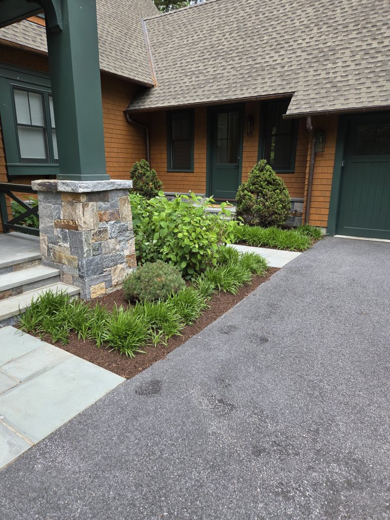 Finished landscaping around a home's front entrance