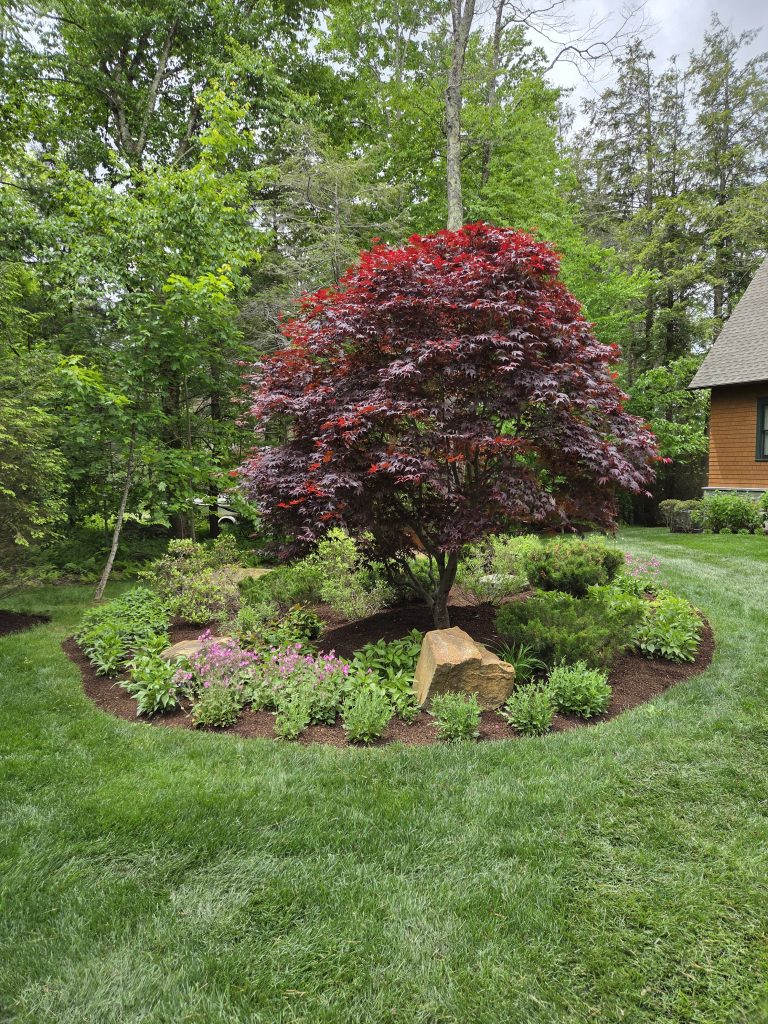 Professional mulch application for outdoor garden beds